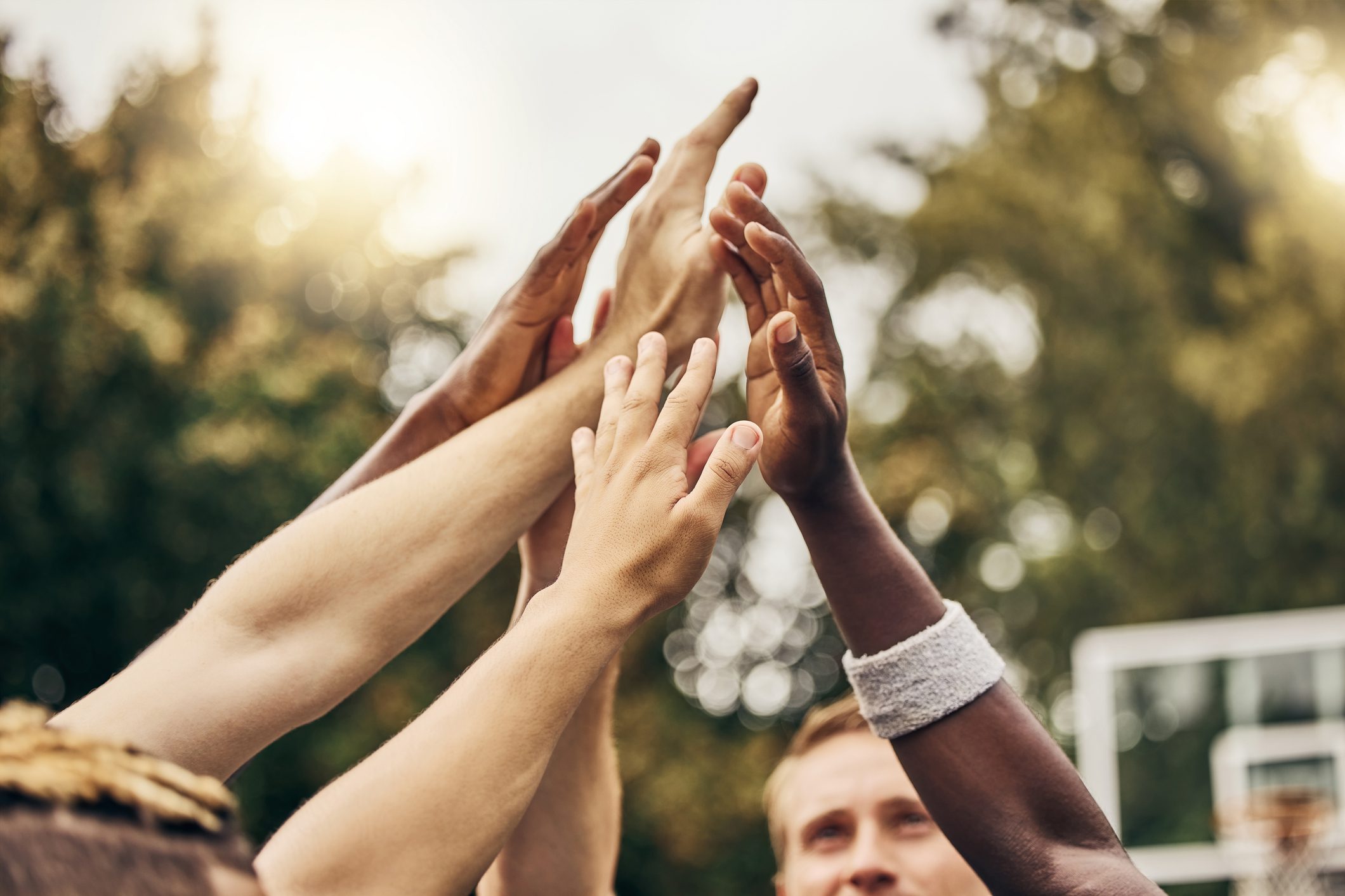 Hands reaching together in unity